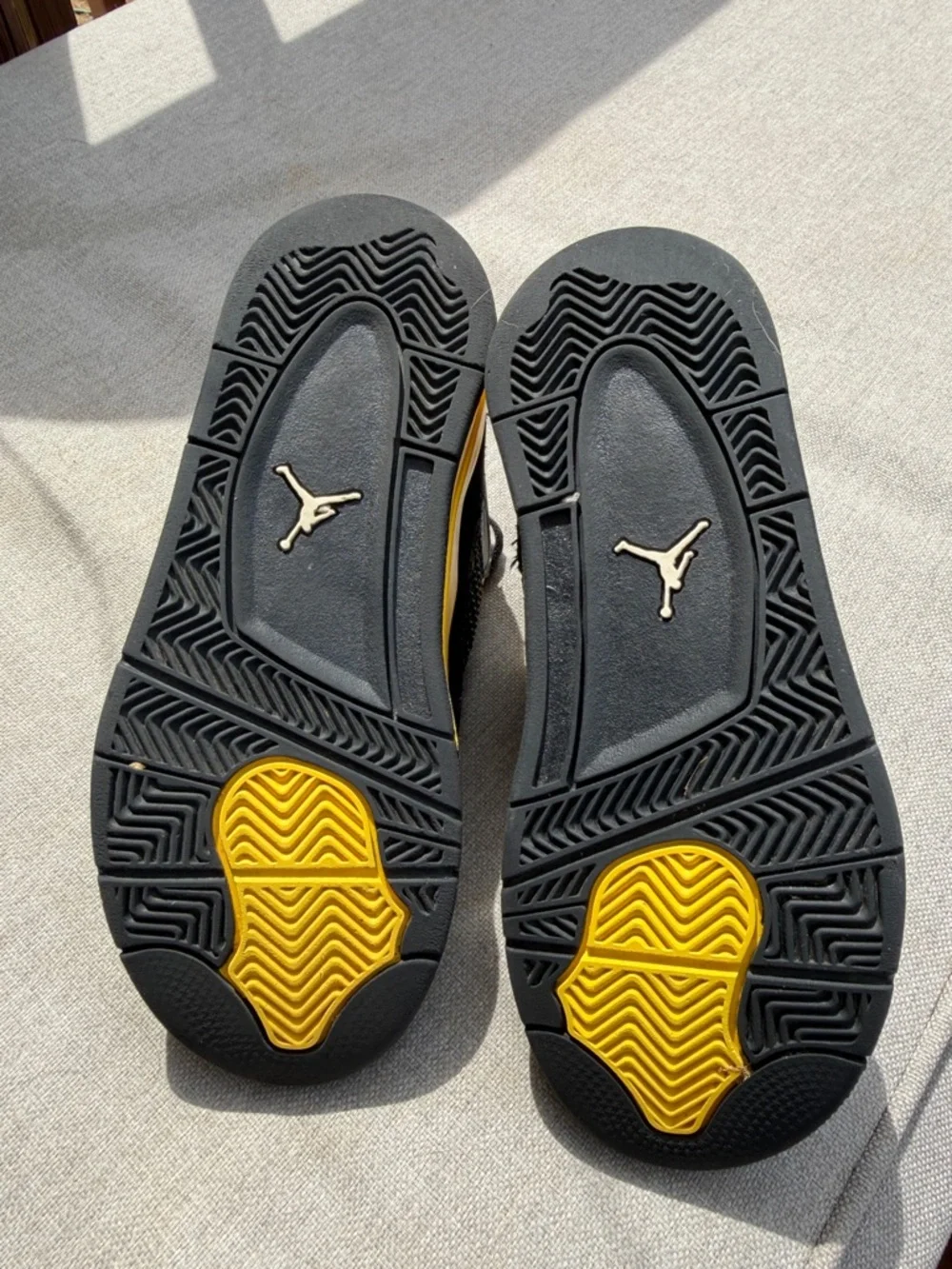 Air Jordan 4 Retro “Thunder” in size 2.5Y GUC.